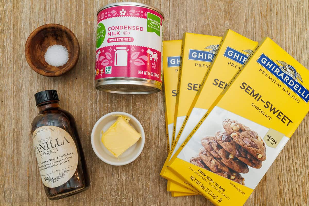 ingredients for the best Holiday treat including condensed milk, salt, vanilla extract, butter and semi-sweet bars