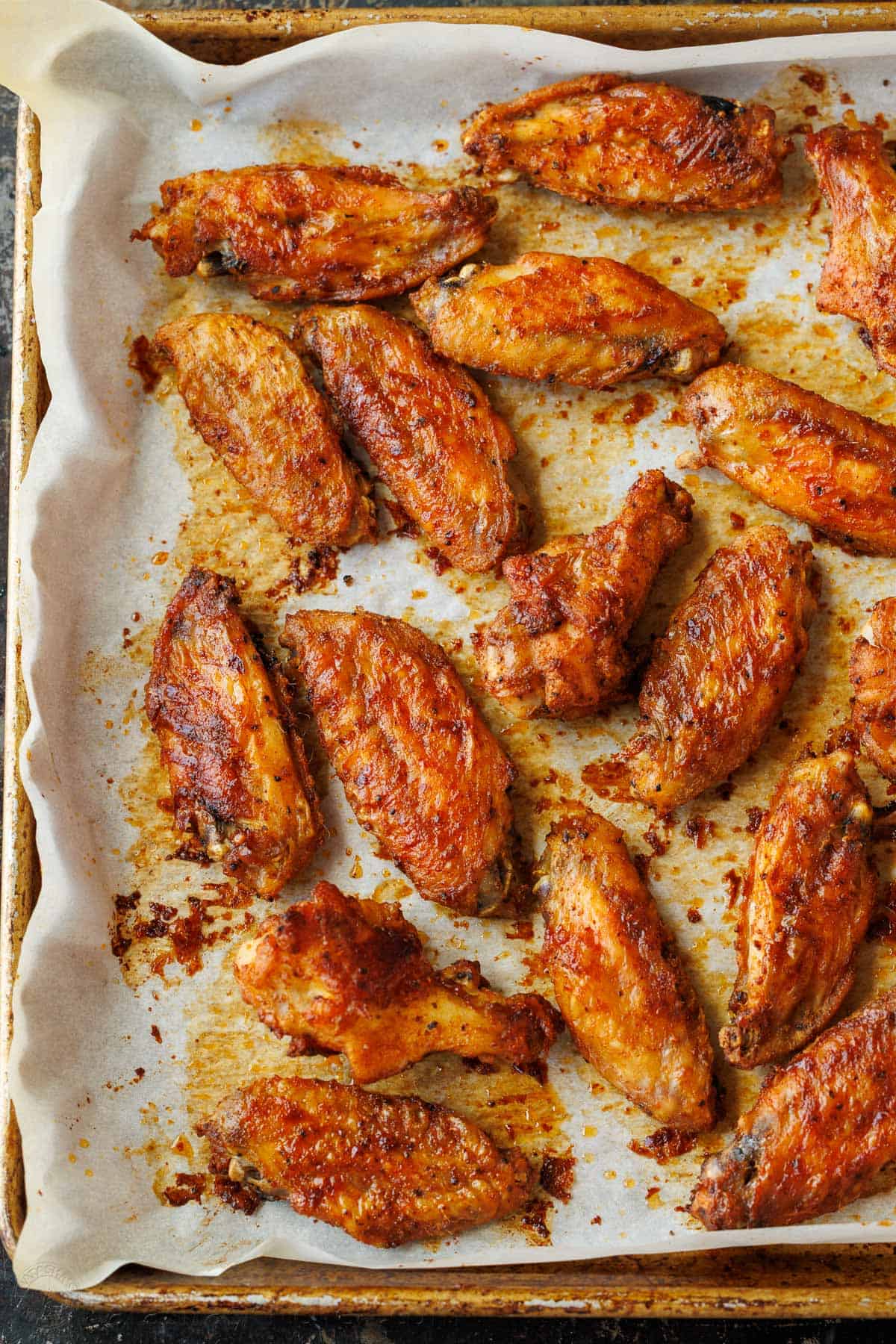 How long to bake chicken wings on a sheet pan with parchment