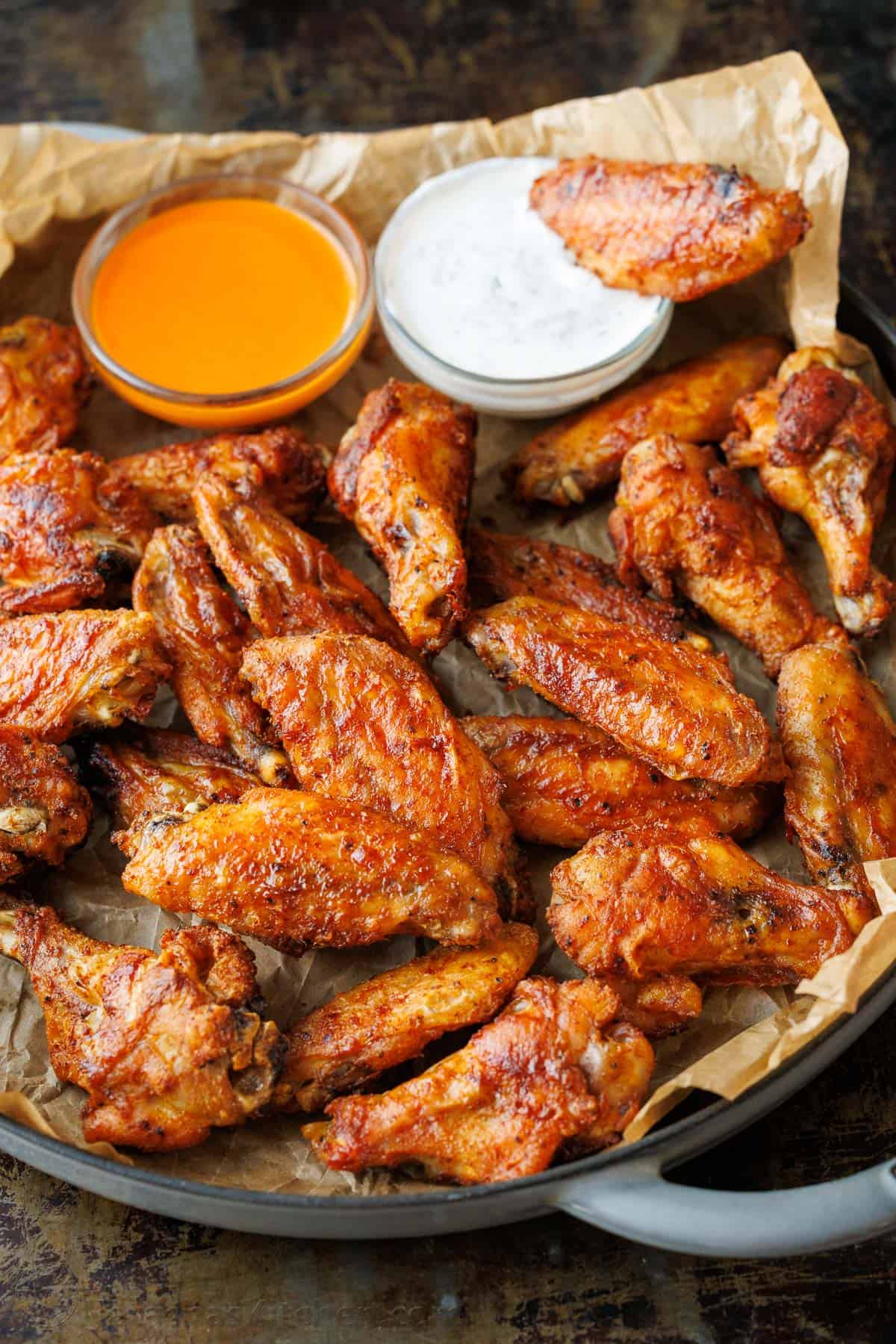 Baked chicken wings recipe with buffalo and ranch sauce for dipping