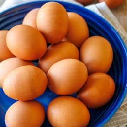 large plate of brown eggs on a blue plate
