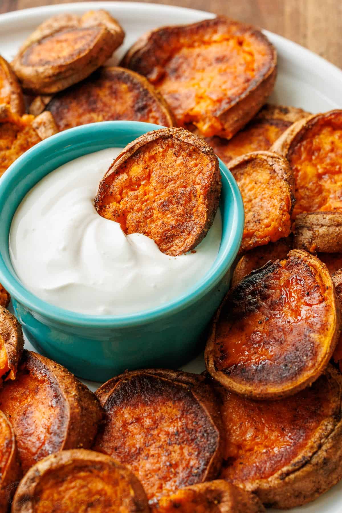 Alternative side dish for French Fries on a serving platter with white dipping sauce in the middle