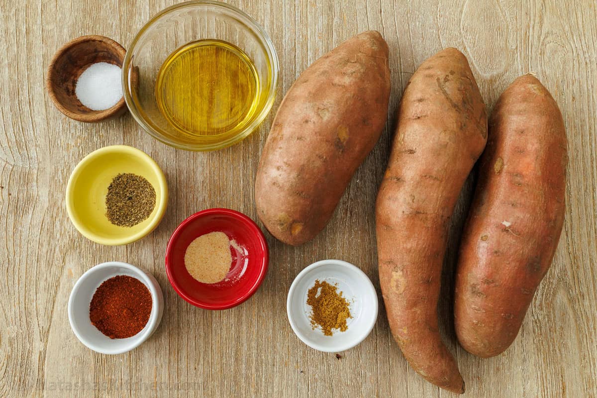 ingredients for easy side dish with spuds, salt, pepper, olive oil, paprika, garlic powder, and cumin