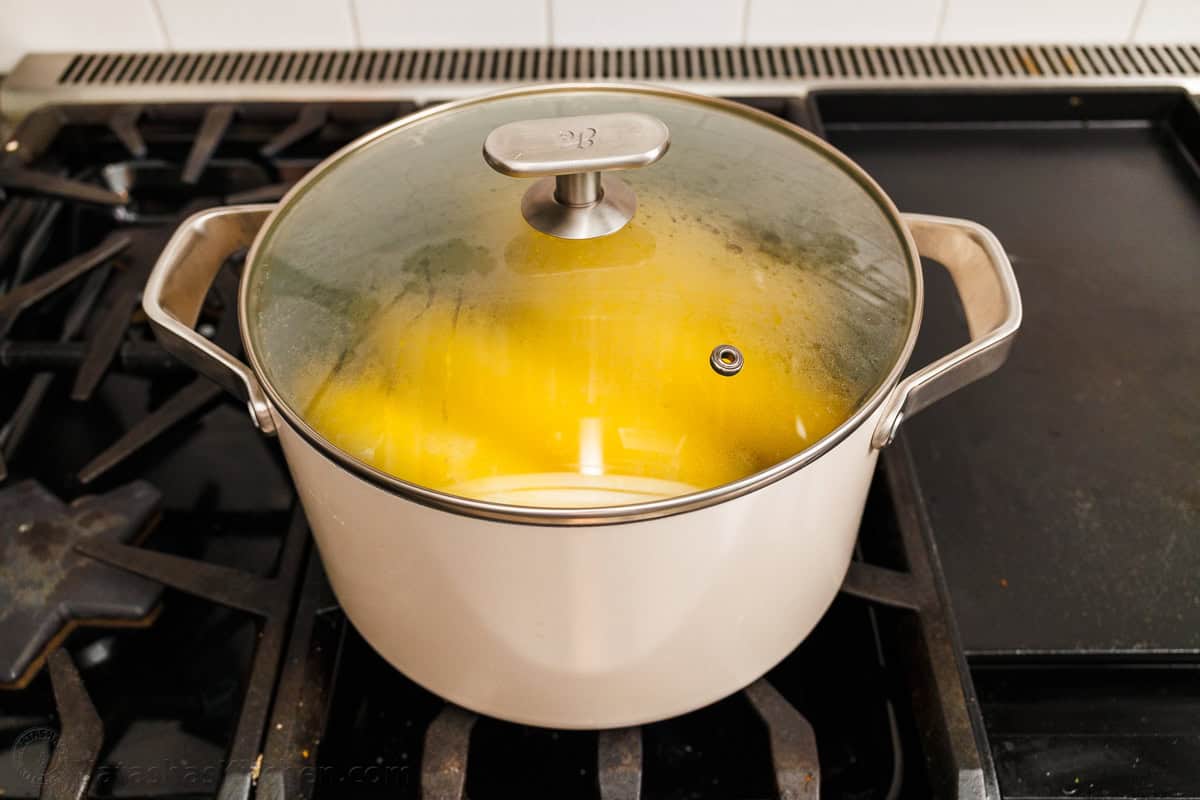 corn warming in a large pot in the covered off-heat method of cooking