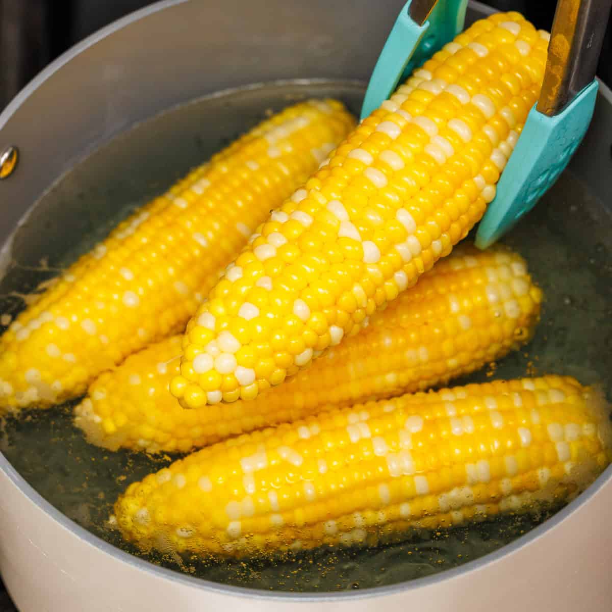 4 boiled corn on the cob removed from large stock pot