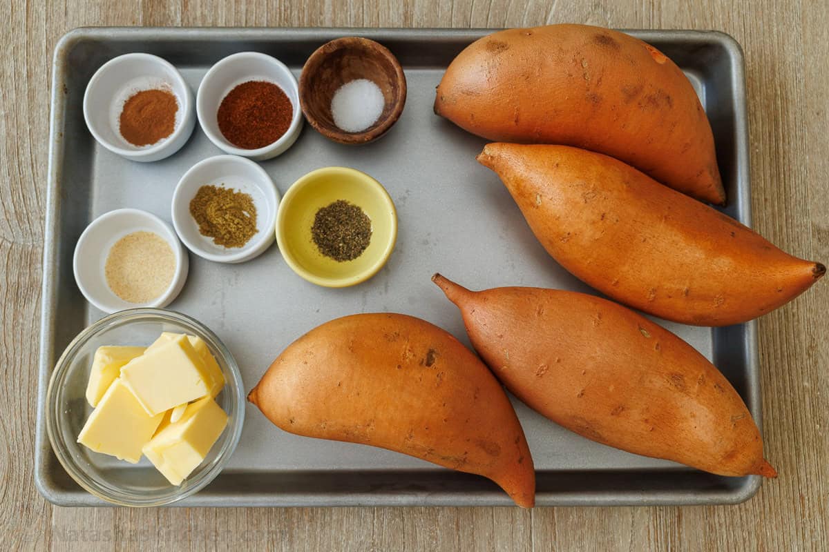 Ingredients for root vegetable side dish in the oven with seasoned butter for caramelizing