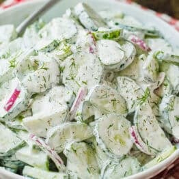 Creamy cucumber salad recipe garnished with dill