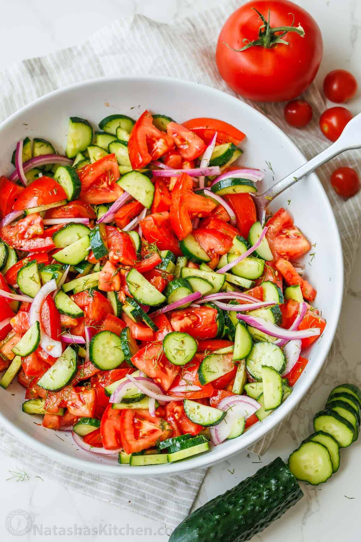 cucumber tomato salad recipe with sliced cucumbers, chopped tomatoes and red onion
