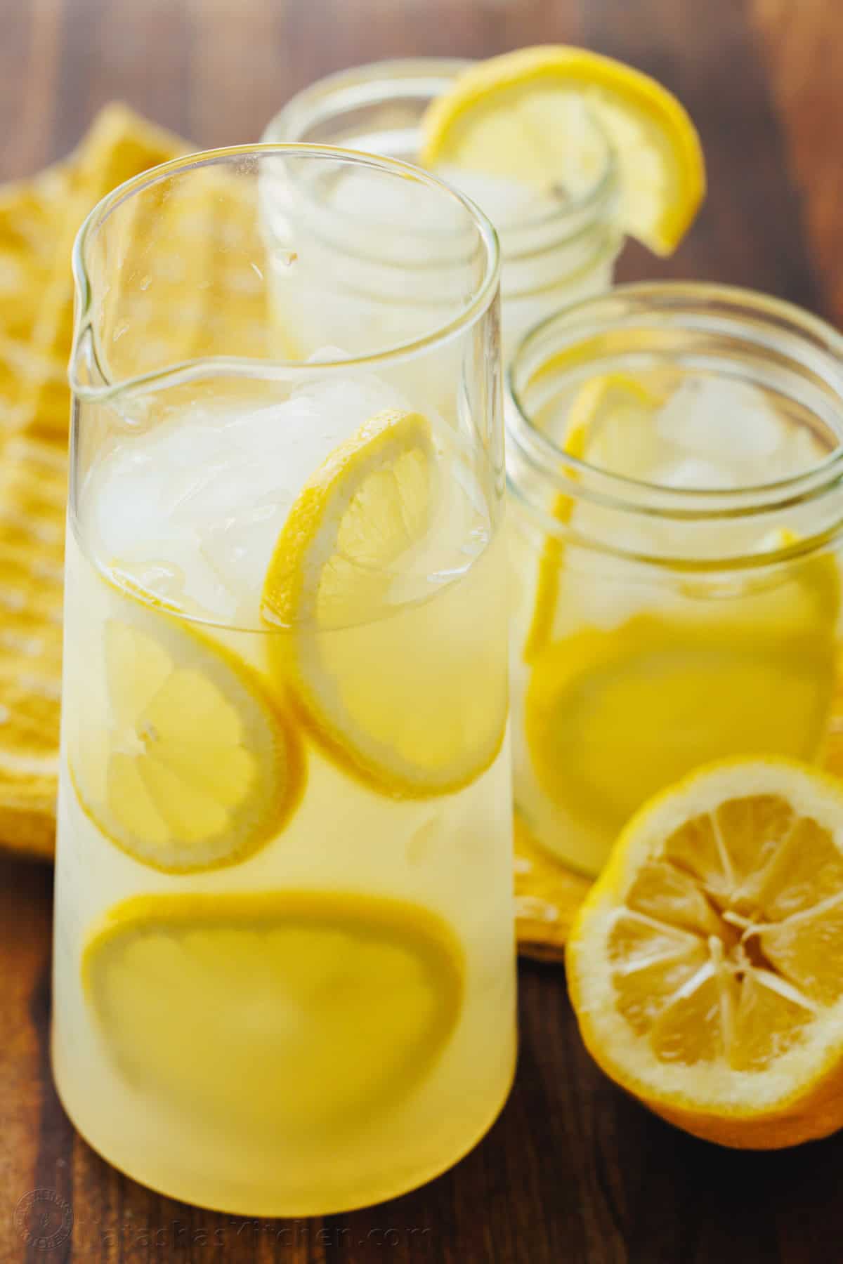 Our Lemonade recipe is so refreshing and easy with just 2 ingredients! Once you try homemade lemonade, it will spoil you forever. Pitcher of homemade lemonade with fresh squeezed lemon juice