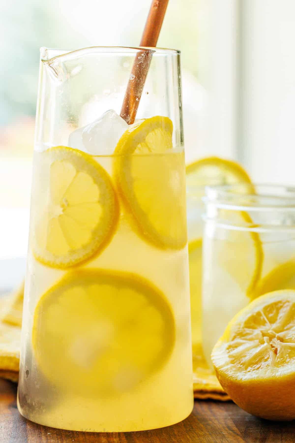 Our Lemonade recipe is so refreshing and easy with just 2 ingredients! Once you try homemade lemonade, it will spoil you forever. Homemade Lemonade recipe in a pitcher ready to store in refrigerator