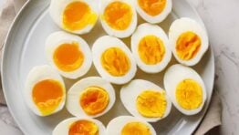 Perfect boiled eggs on a white serving platter