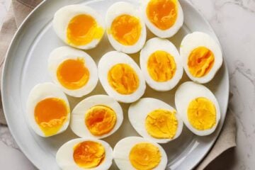 Perfect boiled eggs on a white serving platter