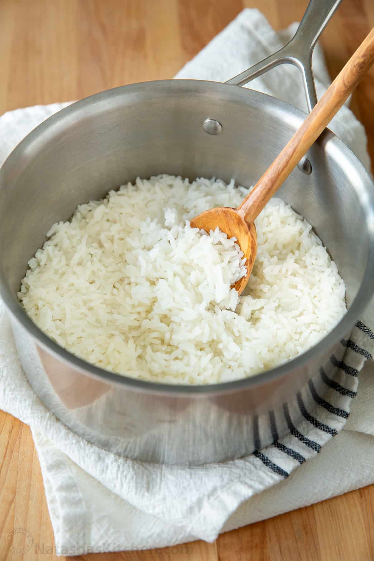 How to cook rice perfectly every time with the best rice-to-water ratio and a foolproof stovetop method for fluffy white rice. Get the recipe! Cooked White Rice in a saucepan