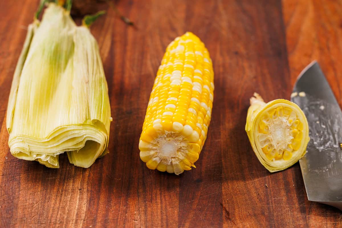 Microwave corn on the cob is the easiest way to serve corn in just minutes! No need to remove the husks. It's the perfect summer side dish. How to remove husks from microwave corn on the cob recipe