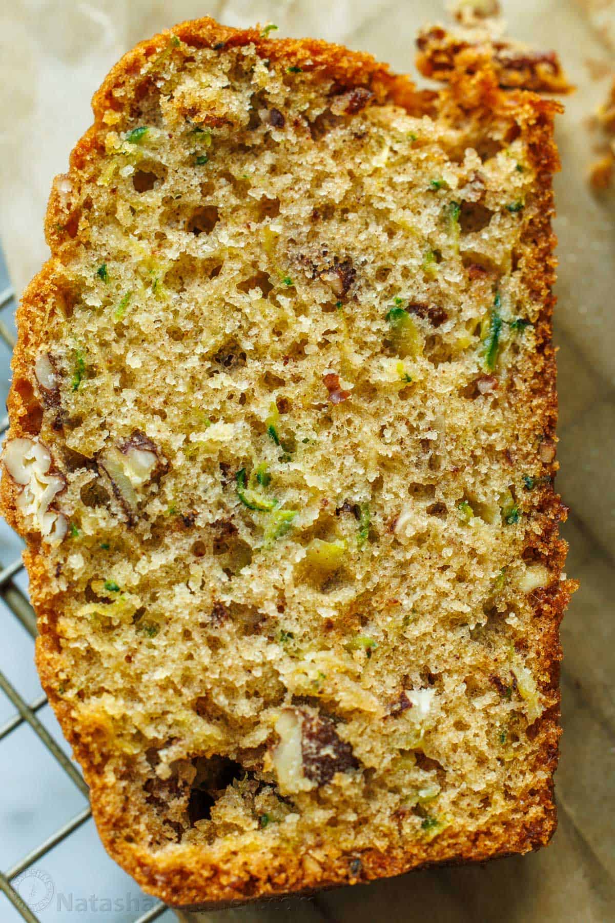 up close slice of zucchini bread showing soft moist textured crumb