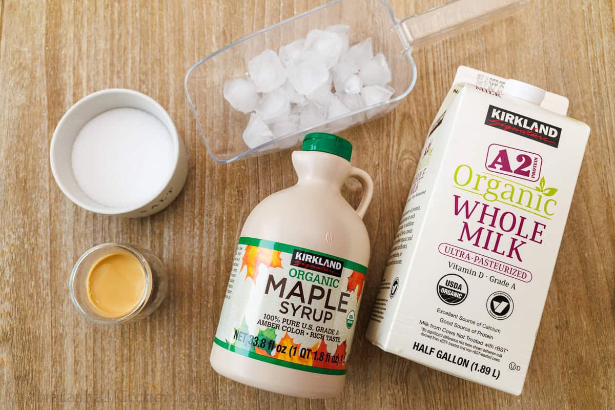 ingredients for viral Salty Canadian iced latte with maple syrup, ice, salt, butter and whole milk