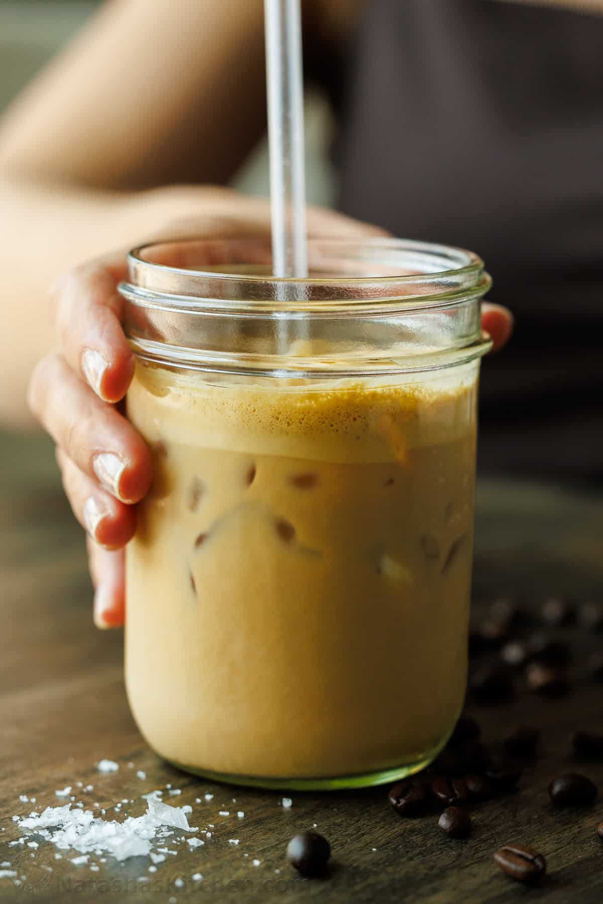 Iced Maple Latte in a mason jar stirred with a straw