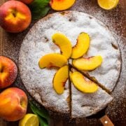 Easy peach cake garnished with fresh sliced peaches