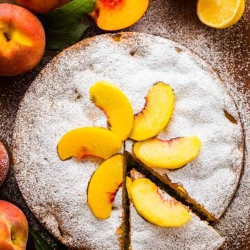 Fresh Peach Cake garnished with peach slices