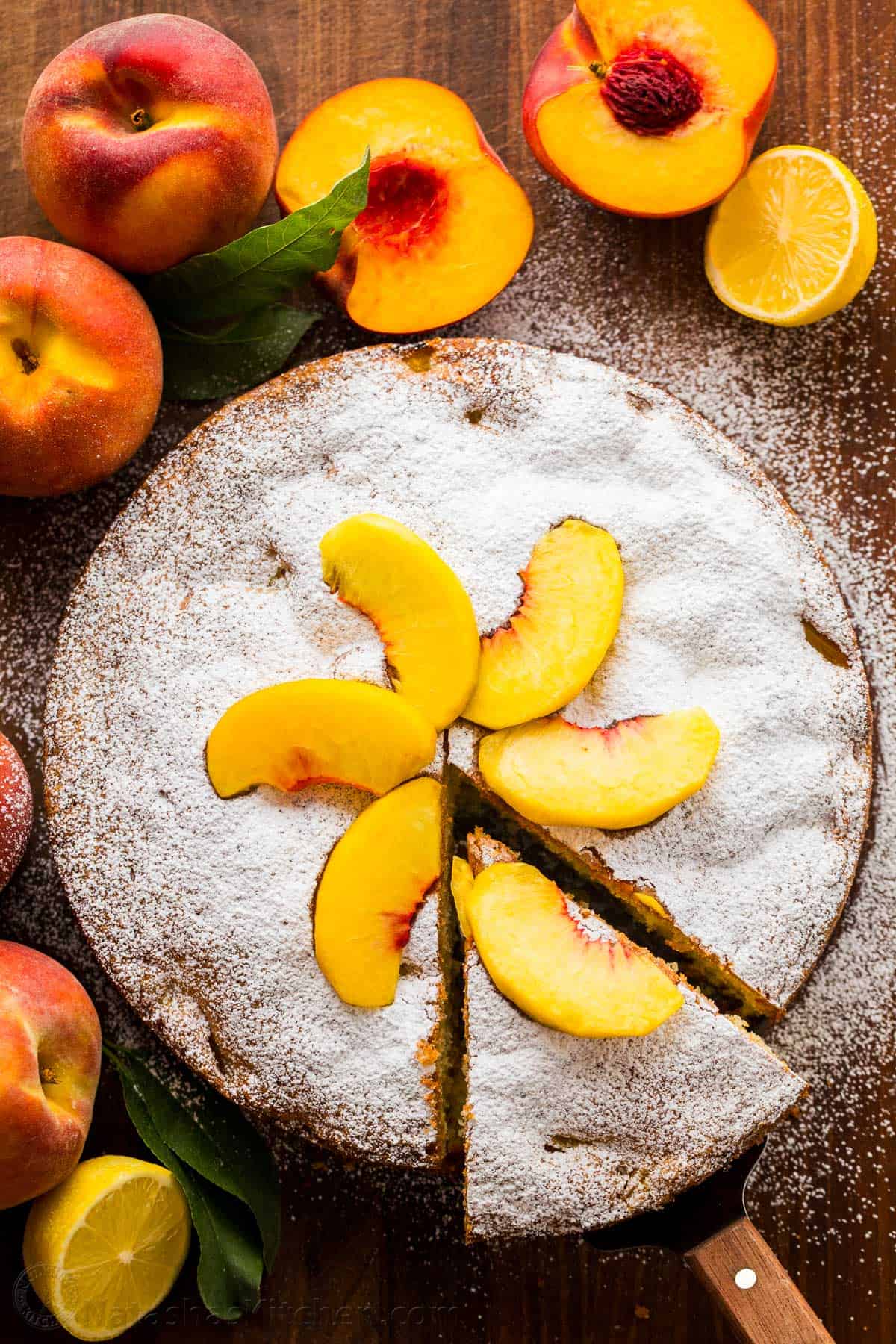 Fresh Peach Cake garnished with peach slices