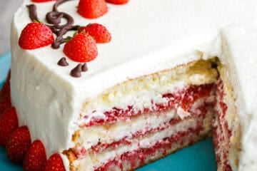 Strawberry Cake with Cream cheese frosting, sliced to show strawberry layers