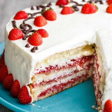 Strawberry Cake with Cream cheese frosting, sliced to show strawberry layers
