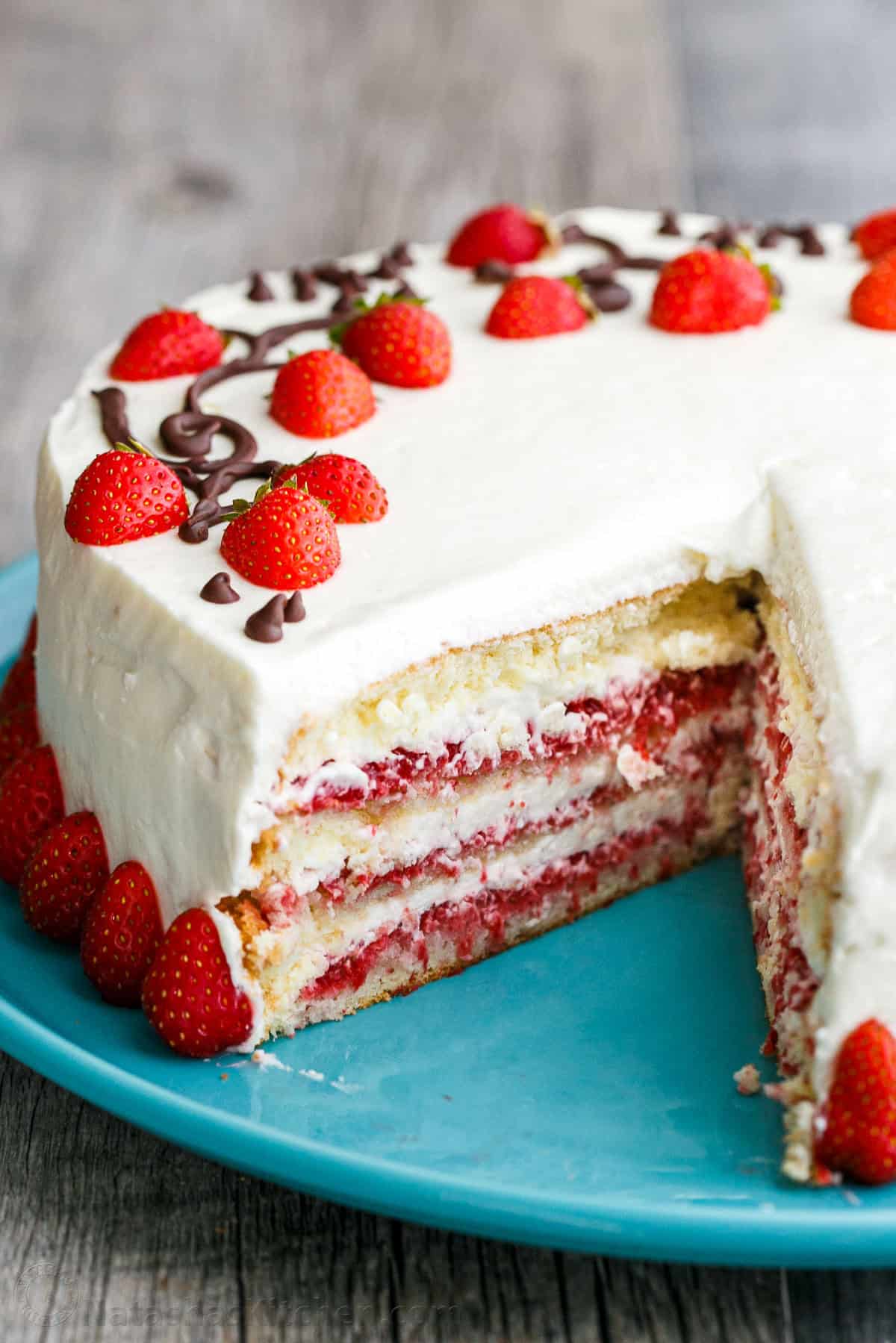 Strawberry Cake with Cream cheese frosting, sliced to show strawberry layers