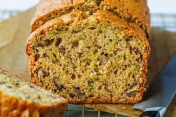 Zucchini Bread sliced on parchment paper
