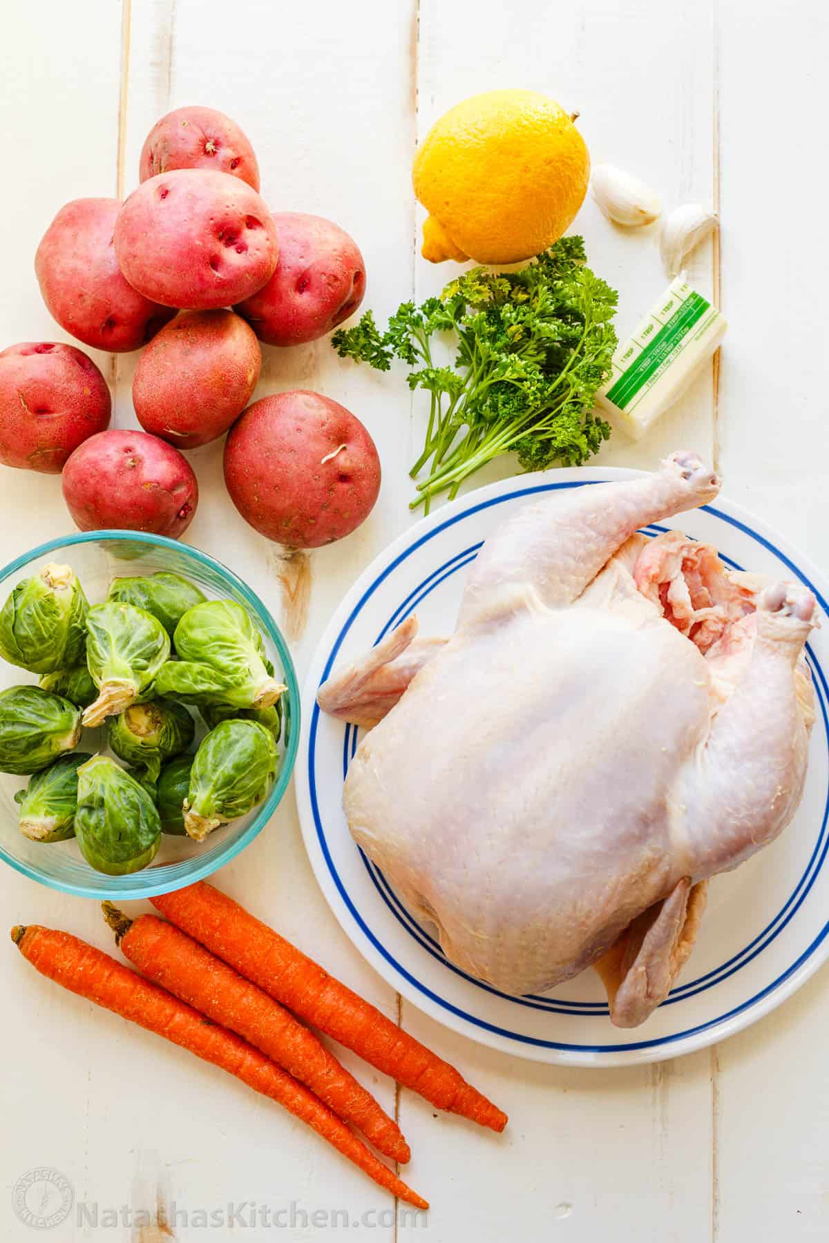 Easy Spatchcock Chicken with juicy meat, crispy skin, and garlic-herb butter. Roast it with vegetables for a simple one-pan dinner. Ingredients for spatchcock chicken with a whole chicken, vegetables and garlic herb butter